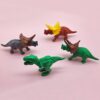 61g33BawhL._SL1500_.jpg Set of 4 Miniature Unique Decoration Items Gifts for Kids Rubber Dinosaur Miniature Eraser Stationary Set for Kids Amazon.in Home & KitchenRufus AI