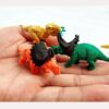 61nNdRvXj6L._SL1500_.jpg Set of 4 Miniature Unique Decoration Items Gifts for Kids Rubber Dinosaur Miniature Eraser Stationary Set for Kids Amazon.in Home & KitchenRufus AI